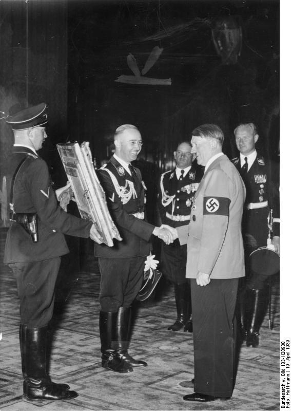 Heinrich Himmler offers Adolf Hitler a painting for his 50th birthday